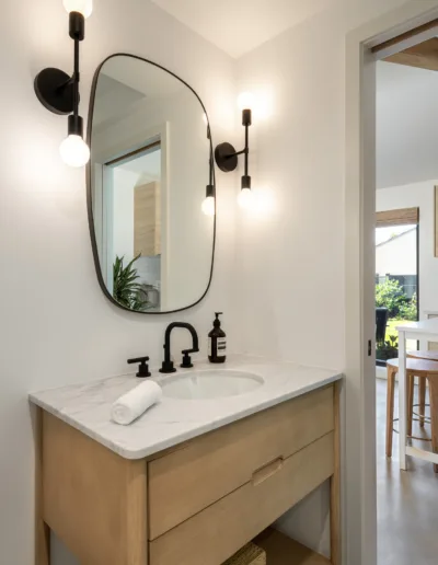 A modern bathroom with a sink and mirror.