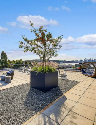 A rooftop patio with a view of the city.