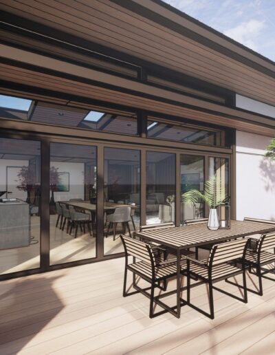 Modern backyard patio with outdoor furniture, large sliding glass doors, and a well-lit dining area inside the house.